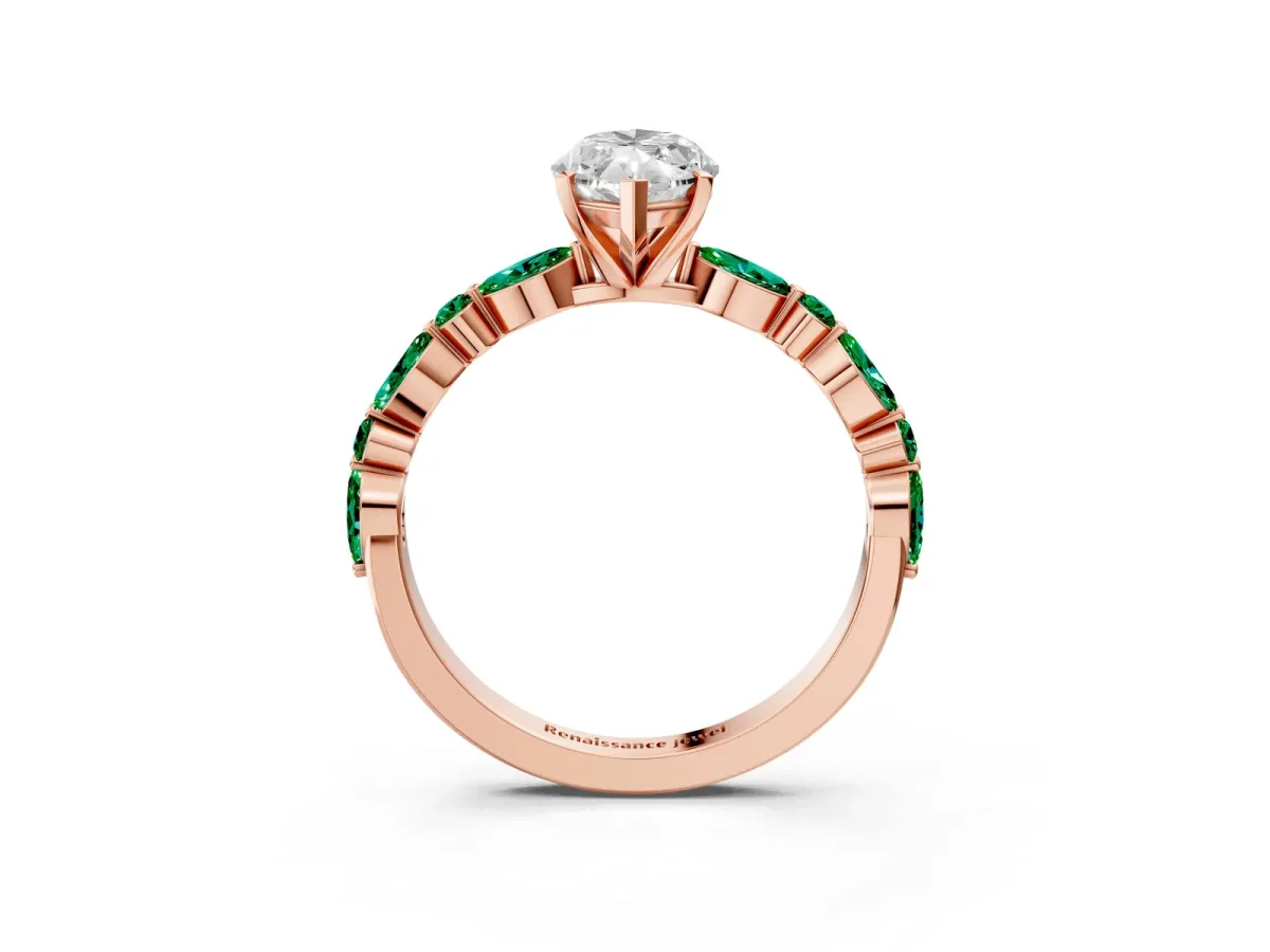 Marquise Cut Diamond Ring with Marquise and Round Emerald Side Stones and Four-Prong Setting Rose gold