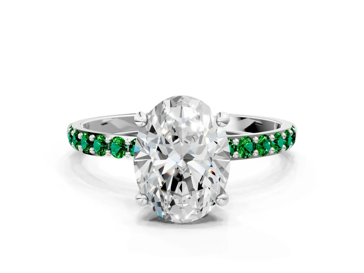 Oval Cut Diamond Solitaire Ring with Round Emerald Pavé Band and Prong Setting Silver