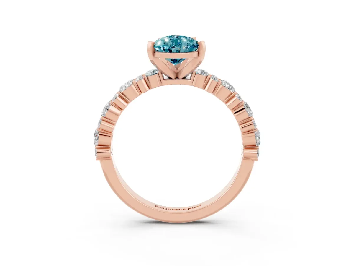 Pear Cut Blue Topaz Side Stone Solitaire Ring with Round and Four-Prong Setting Rose gold