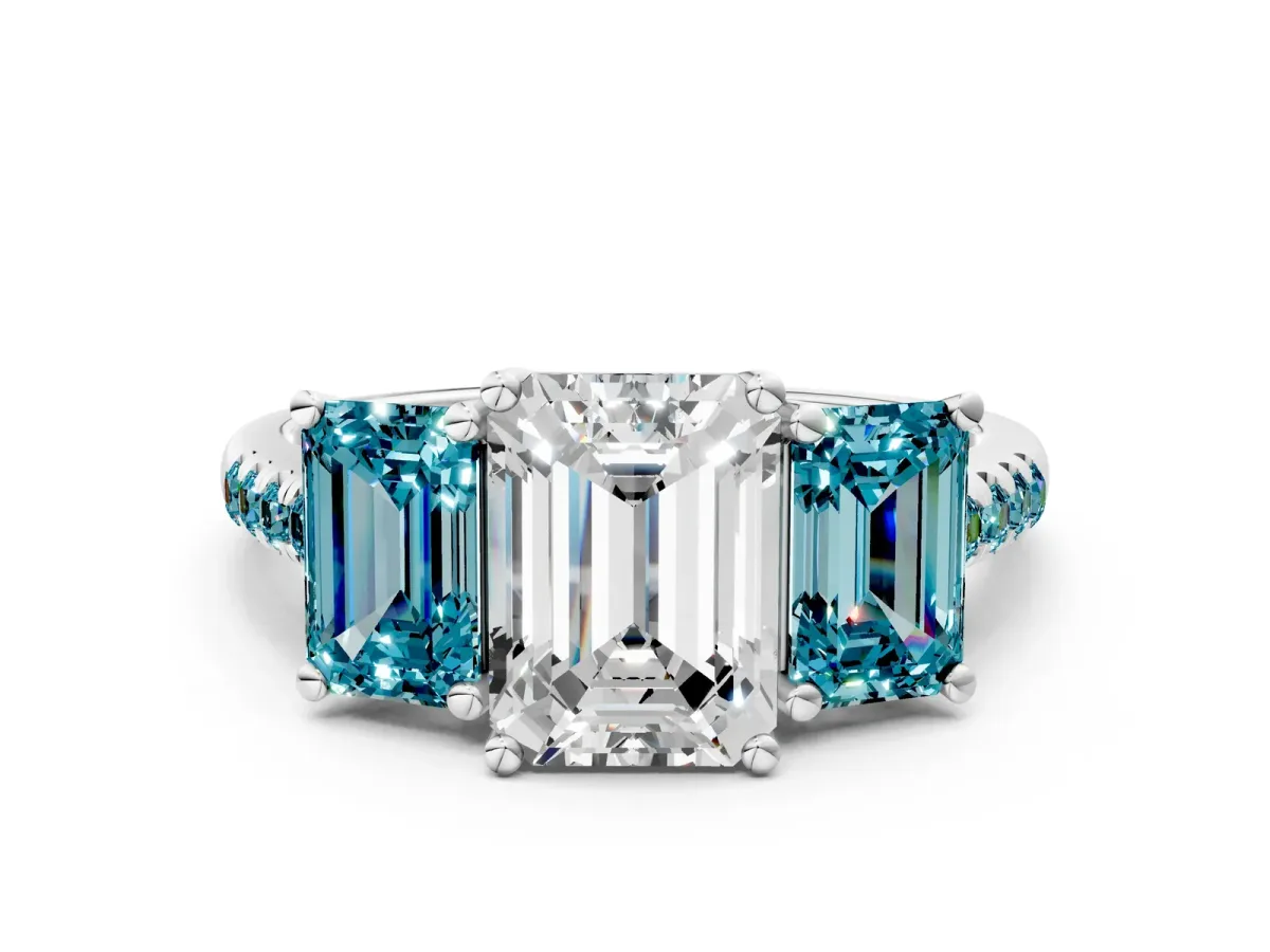 Three-Stone Emerald Cut Diamond Ring with Round Blue Topaz Pavé Band and Prong Setting Platinum