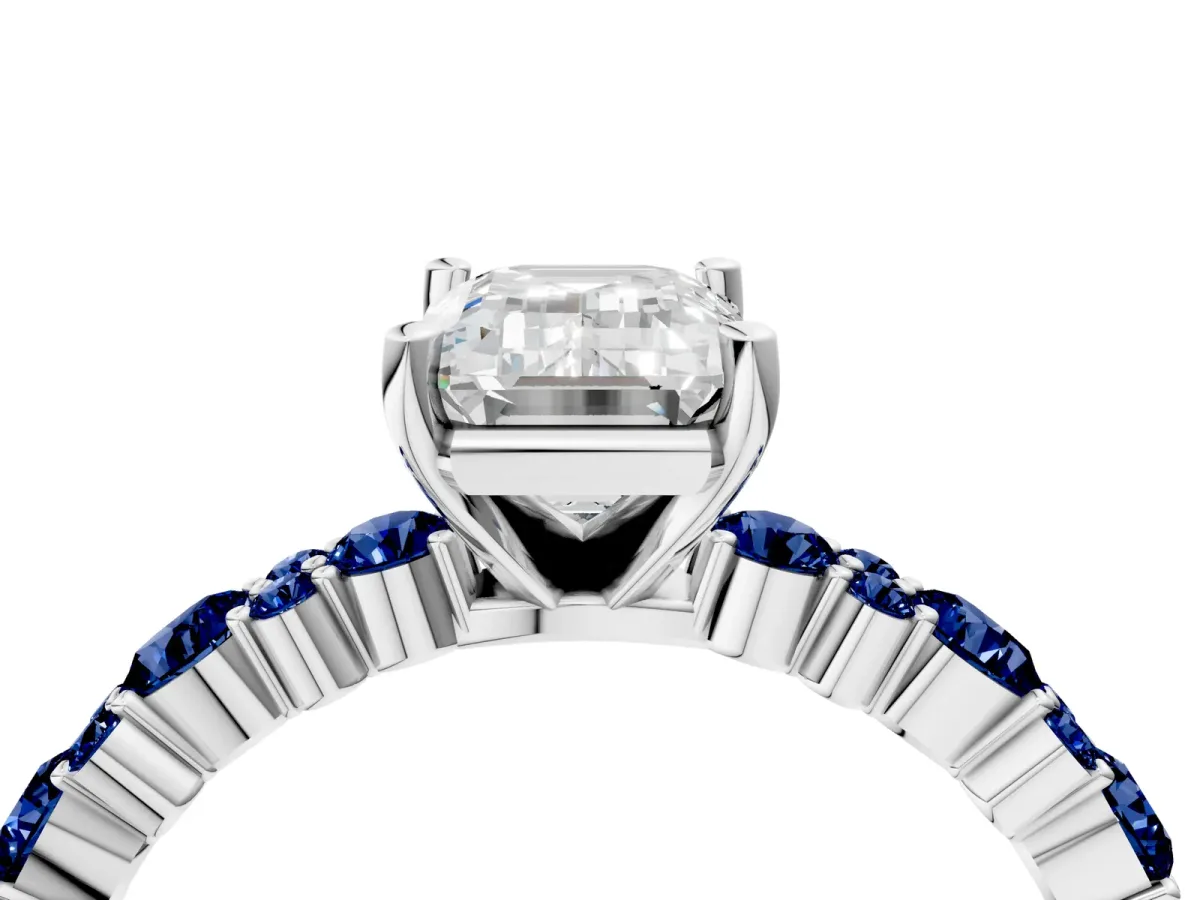 Emerald Cut Diamond Side Stone Solitaire Ring with Round Blue Sapphire and Four-Prong Setting Silver