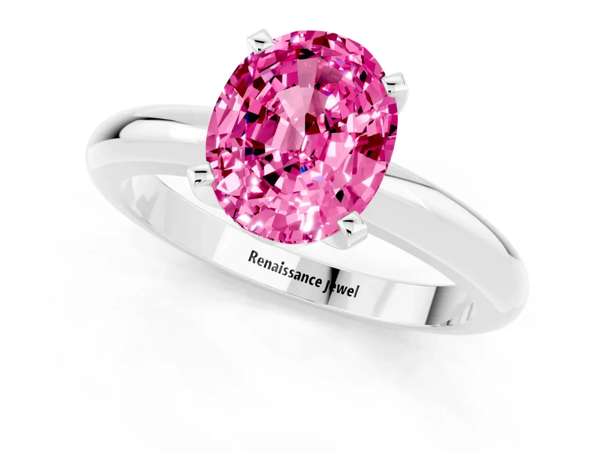 Oval Cut Pink Sapphire Solitaire Engagement Ring with Round Band and Four-Prong Setting Silver
