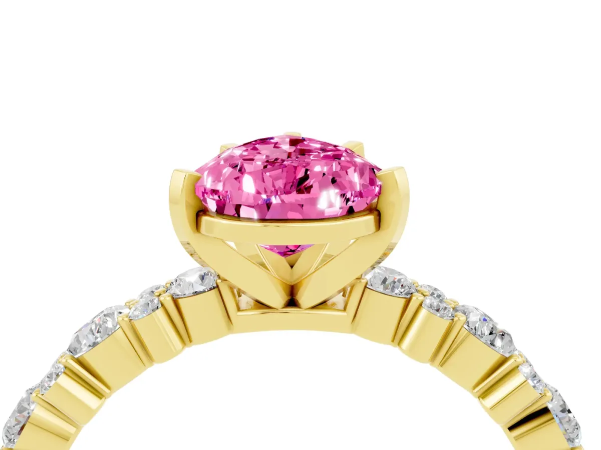 Pear Cut Pink Sapphire Side Stone Solitaire Ring with Round and Four-Prong Setting Yellow gold