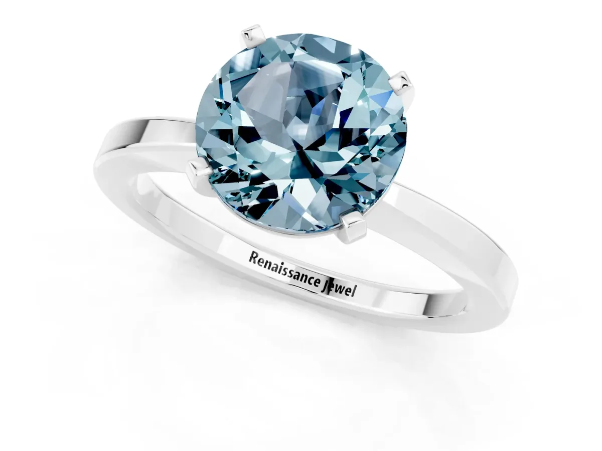 Round Cut Aquamarine Solitaire Engagement Ring with Classic Band and Four-Prong Setting Silver