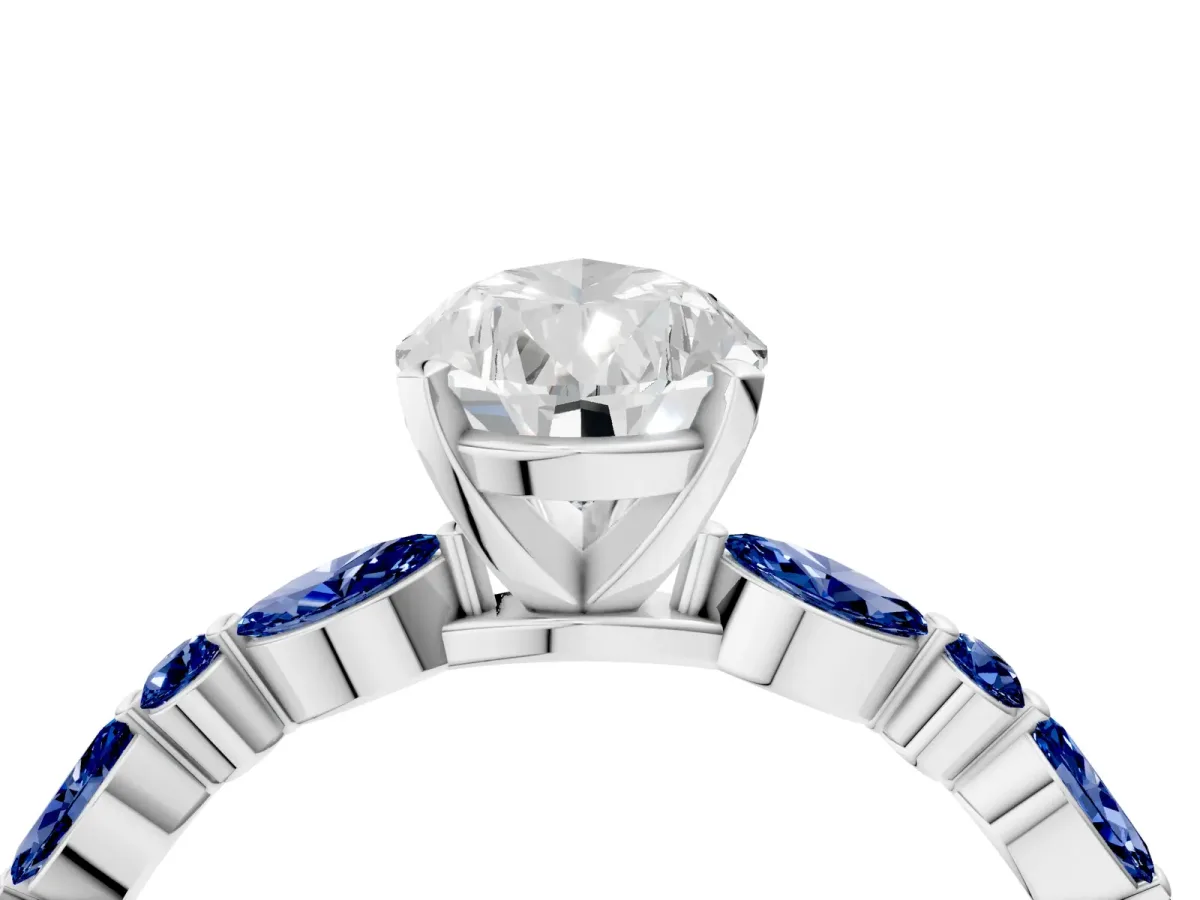 Pear Cut Diamond Ring with Marquise and Round Blue Sapphire Side Stones and Four-Prong Setting Platinum