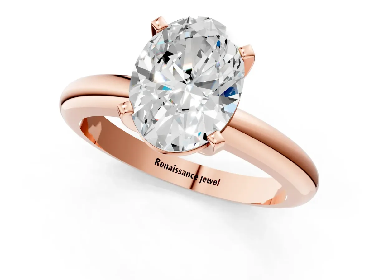 Oval Cut Diamond Solitaire Engagement Ring with Round Band and Four-Prong Setting Rose gold