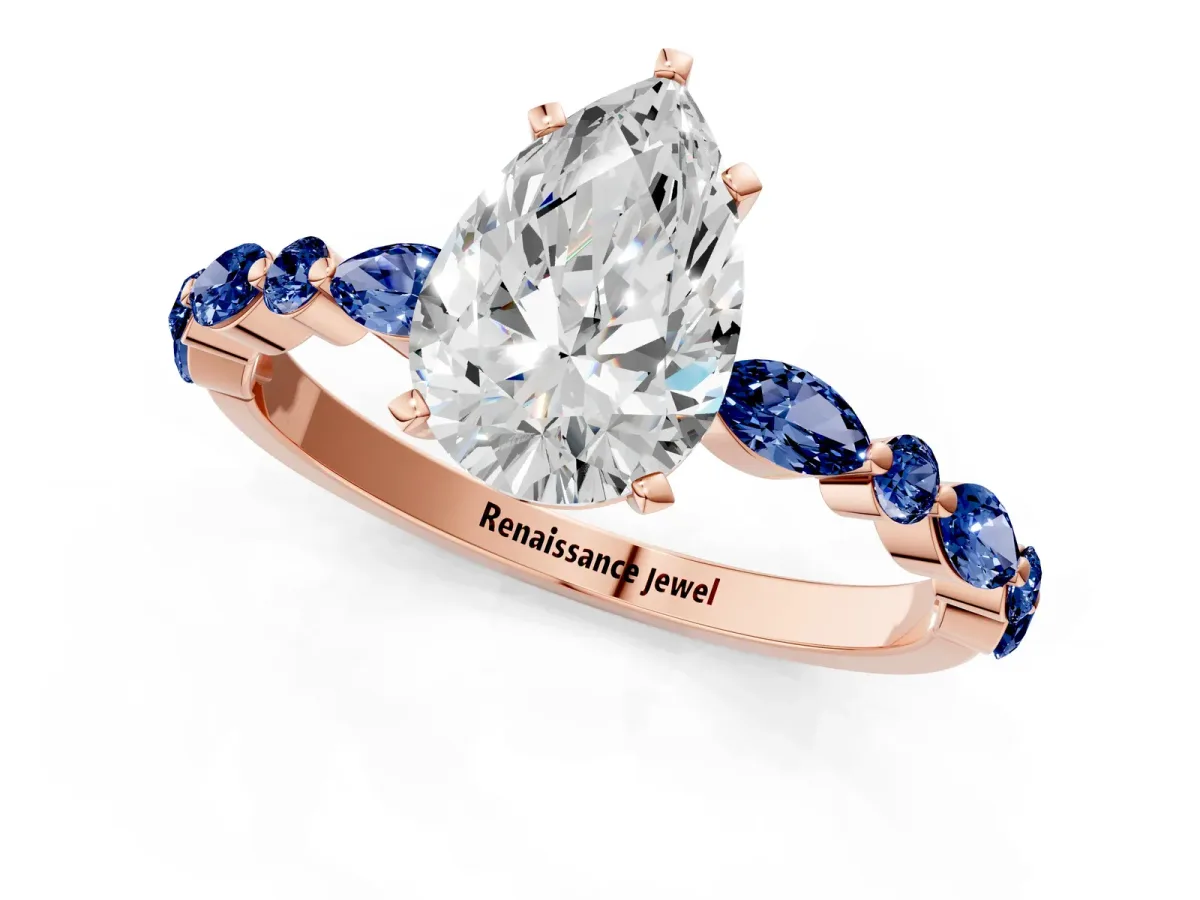Pear Cut Diamond Ring with Marquise and Round Blue Sapphire Side Stones and Four-Prong Setting Rose gold