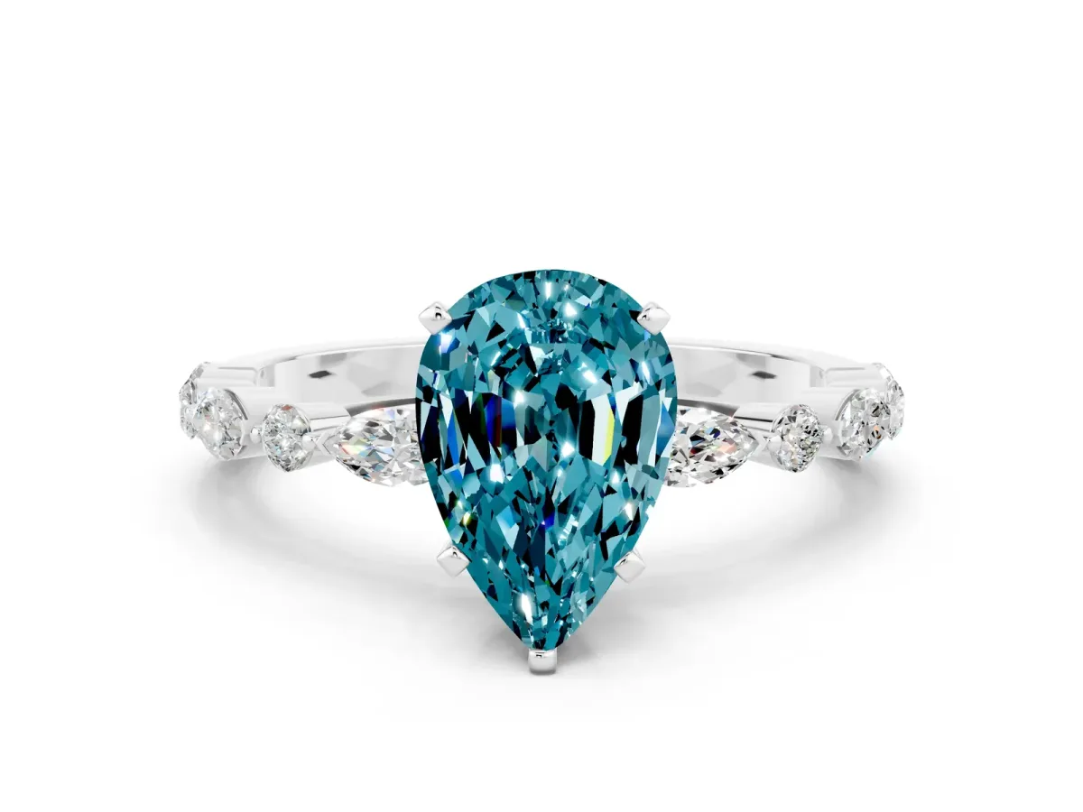 Pear Cut Blue Topaz Ring with Marquise and Round Side Stones and Four-Prong Setting Platinum
