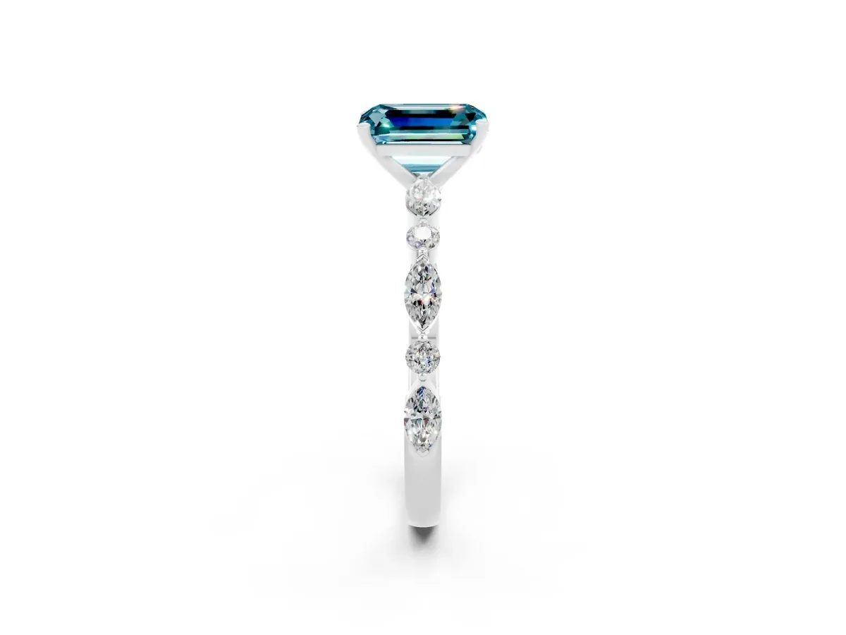 Emerald Cut Blue Topaz Ring with Marquise and Round Side Stones and Four-Prong Setting Silver