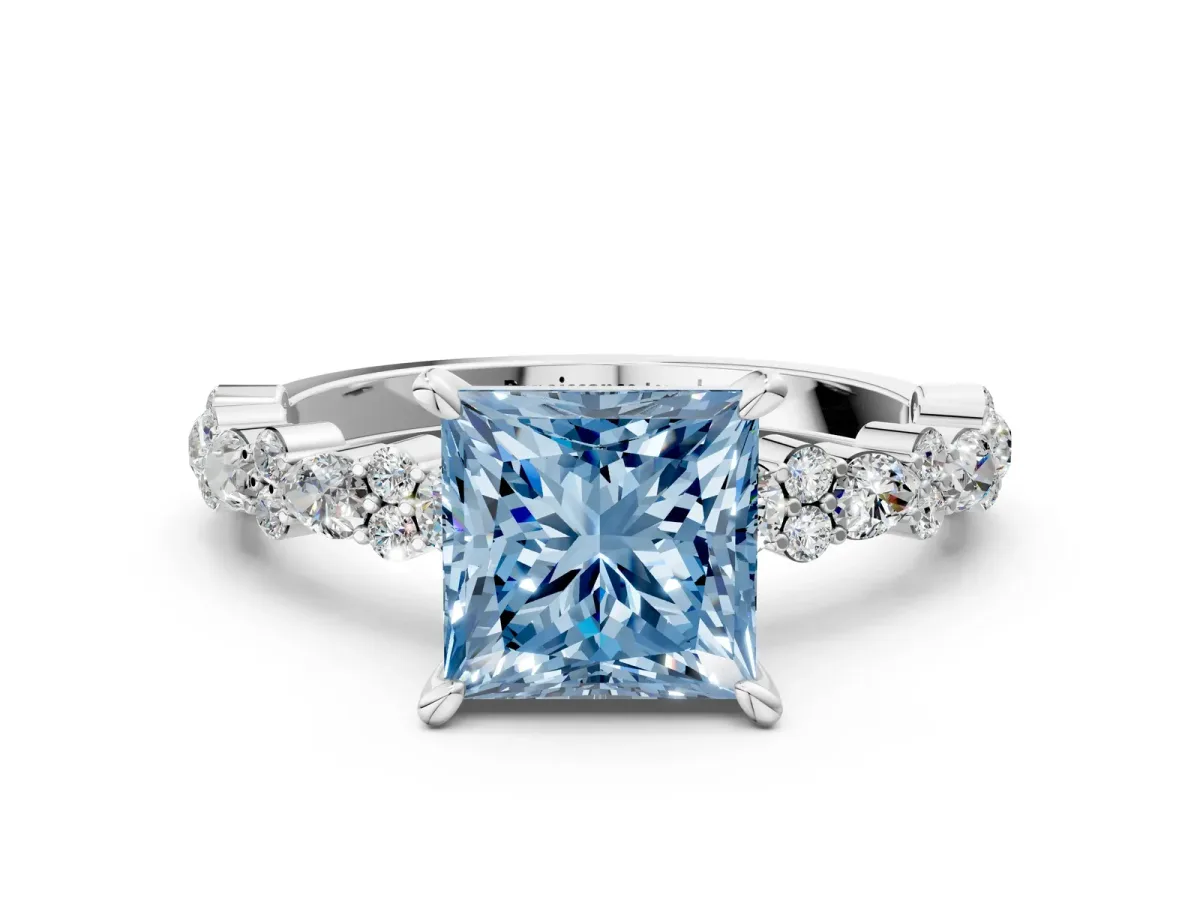Fancy Blue Princess Cut Diamond Side Stone Solitaire Ring with Round and Four-Prong Setting Silver