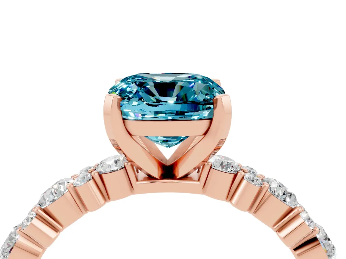 Cushion Cut Blue Topaz Side Stone Solitaire Ring with Round and Four-Prong Setting Rose gold