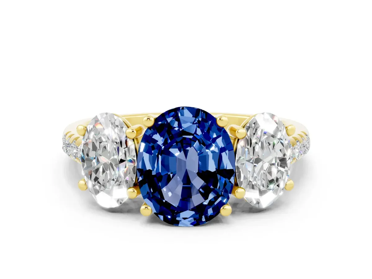 Three-Stone Oval Cut Blue Sapphire Ring with Round Pavé Band and Prong Setting Yellow gold
