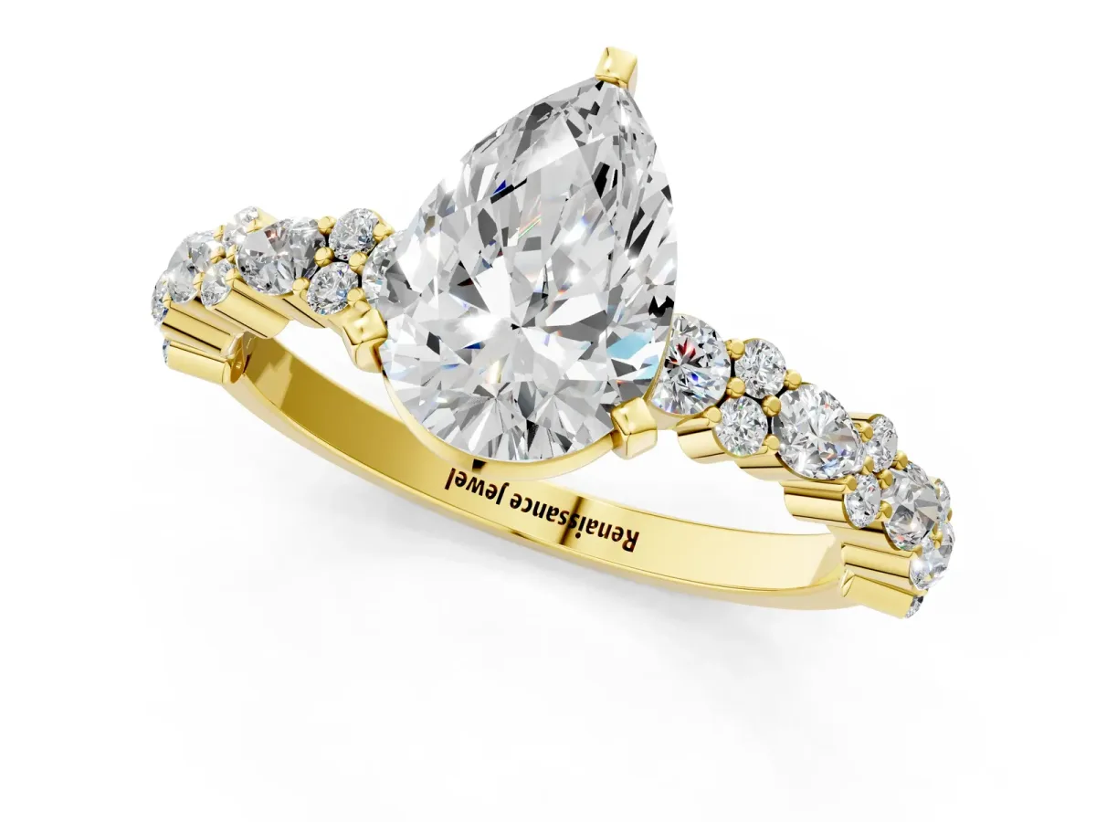 Pear Cut Diamond Side Stone Solitaire Ring with Round and Four-Prong Setting Yellow gold