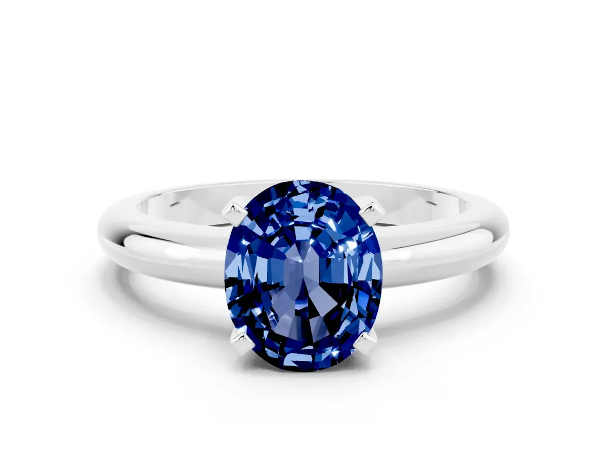 Oval Cut Blue Sapphire Solitaire Engagement Ring with Round Band and Four-Prong Setting Silver