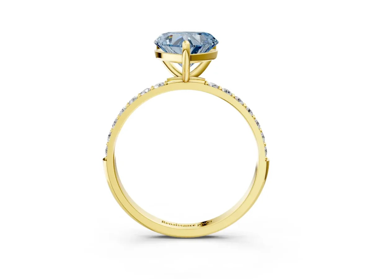 Fancy Blue Heart Cut Diamond Solitaire Ring with Round Pavé Band and Prong Setting Yellow gold