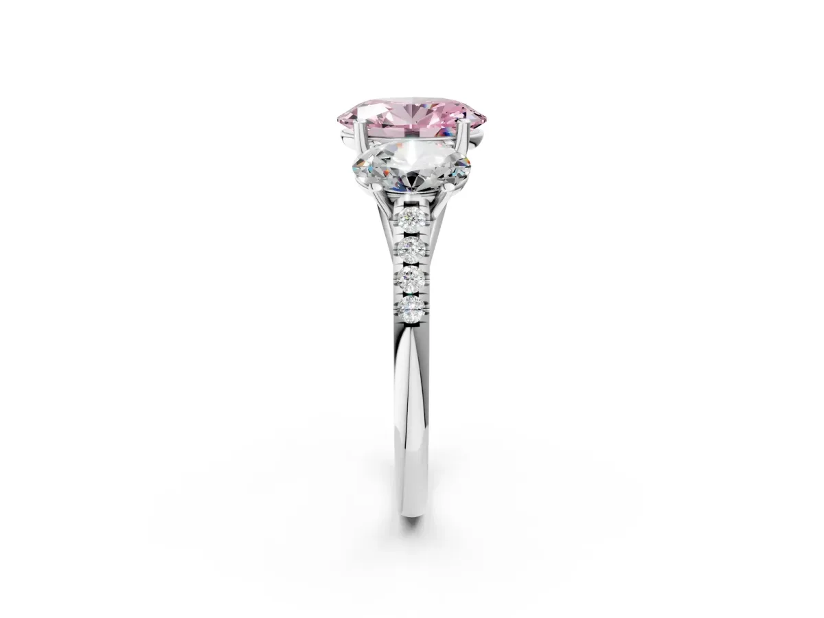 Fancy Pink Three-Stone Oval Cut Diamond Ring with Round Pavé Band and Prong Setting White gold