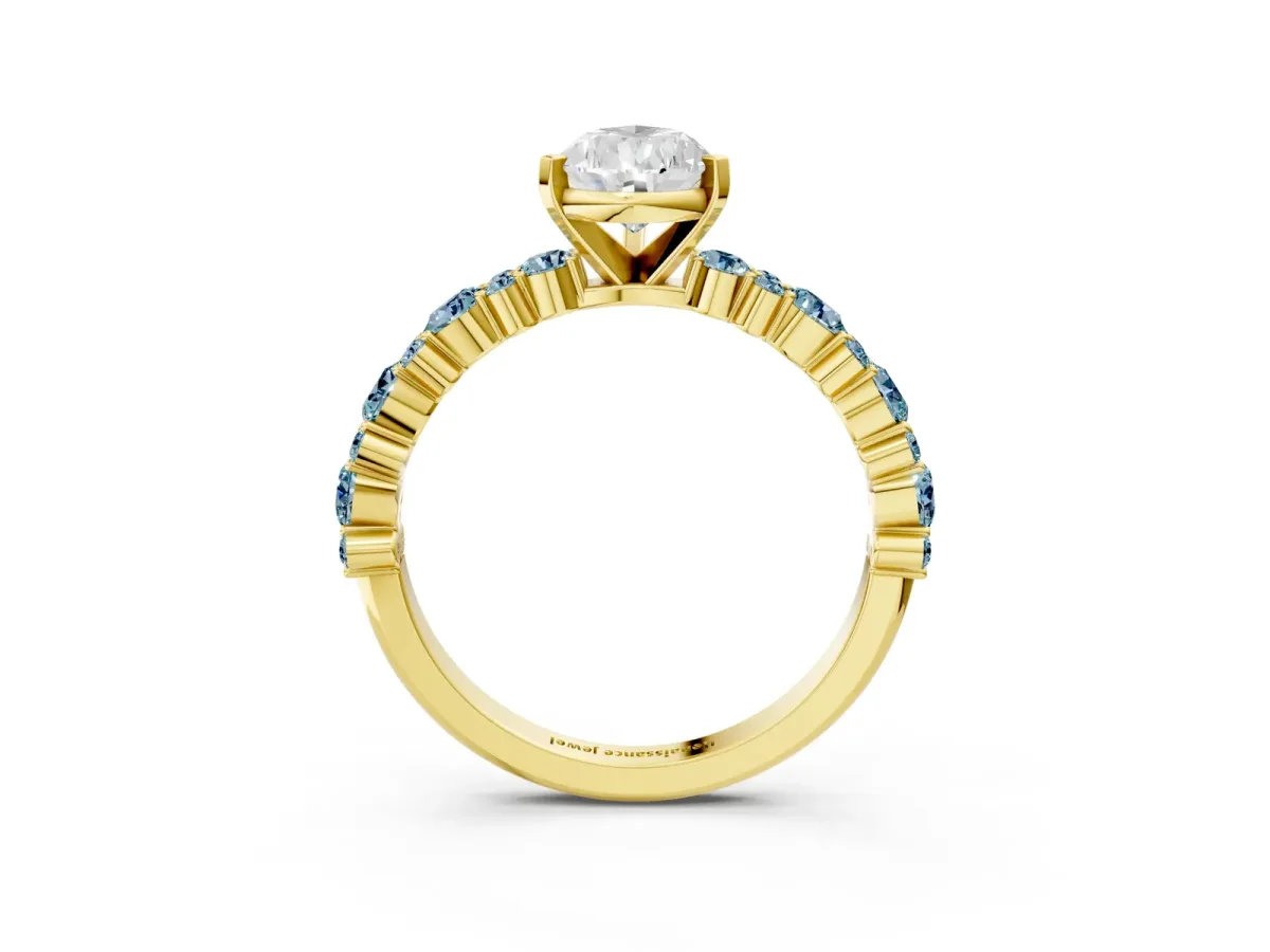 Pear Cut Diamond Side Stone Solitaire Ring with Round Aquamarine and Four-Prong Setting Yellow gold