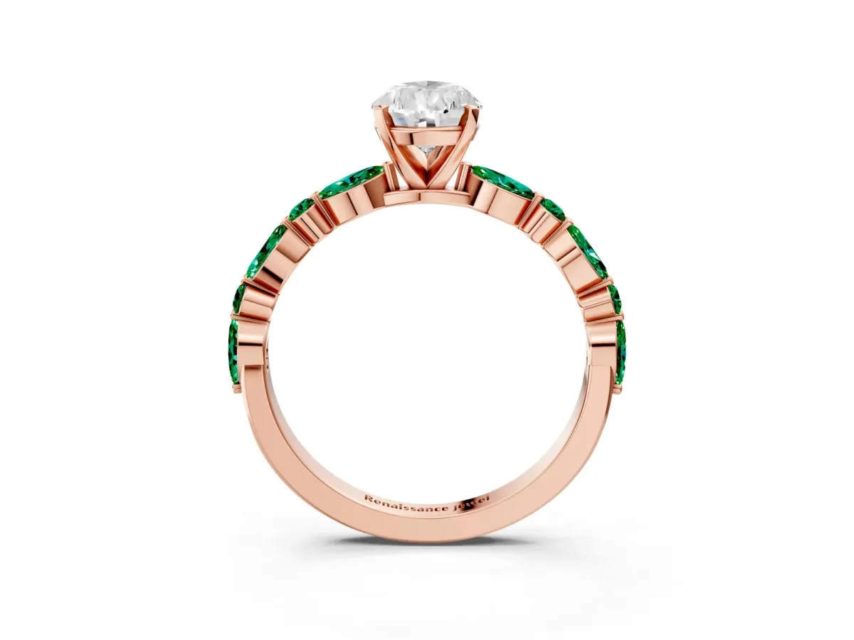 Pear Cut Diamond Ring with Marquise and Round Emerald Side Stones and Four-Prong Setting Rose gold