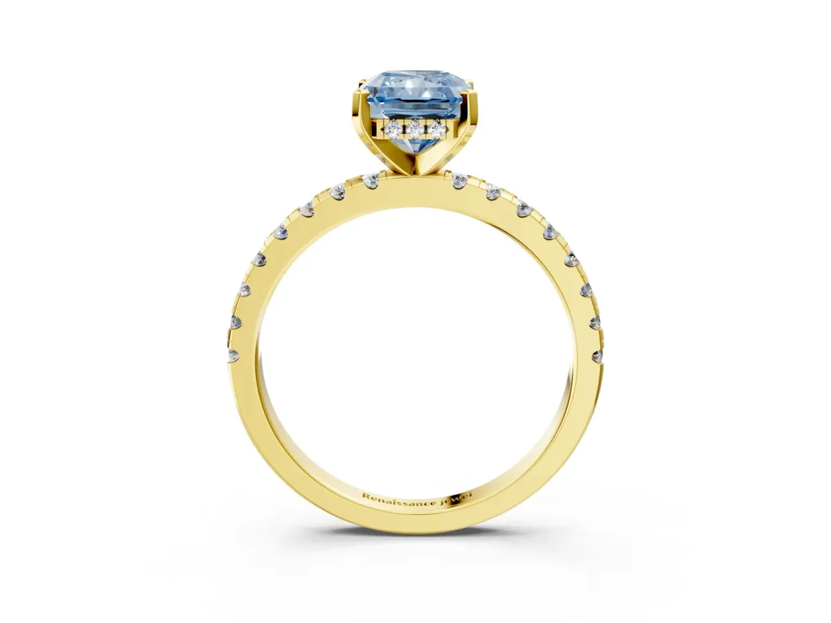 Fancy Blue Radiant Cut Diamond Solitaire Ring with Round Pavé Band and Four-Prong Setting Yellow gold