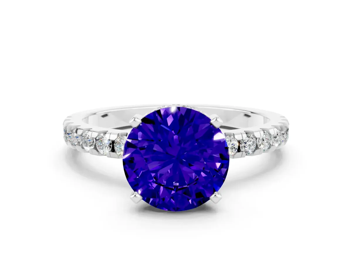 Round Cut Tanzanite Solitaire Ring with Round Pavé Band and Four-Prong Setting Silver