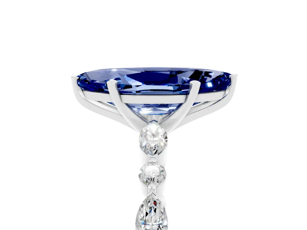 Marquise Cut Blue Sapphire Ring with Marquise and Round Side Stones and Four-Prong Setting Silver