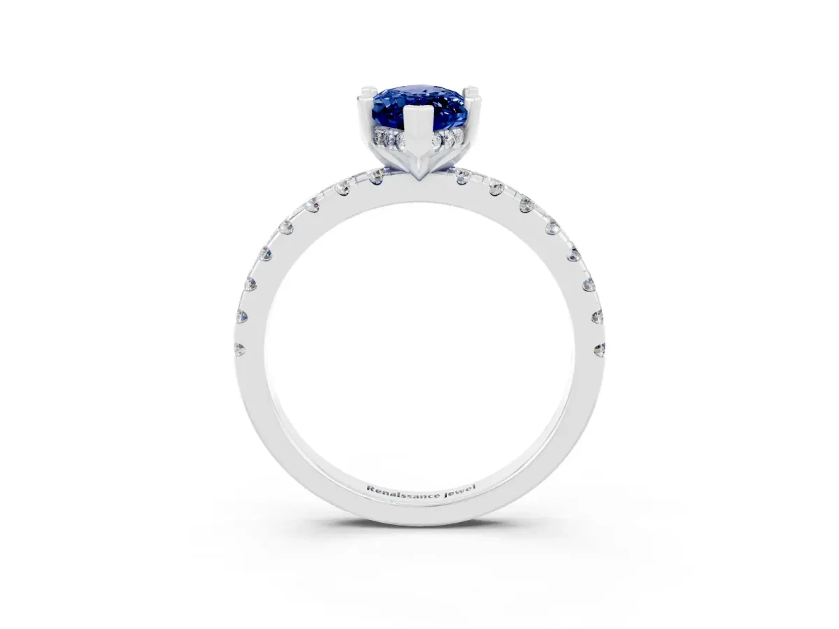 Marquise Cut Blue Sapphire Solitaire Ring with Round Pavé Band and Four-Prong Setting Silver