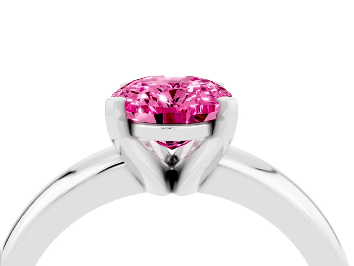 Oval Cut Pink Sapphire Solitaire Engagement Ring with Round Band and Four-Prong Setting Silver