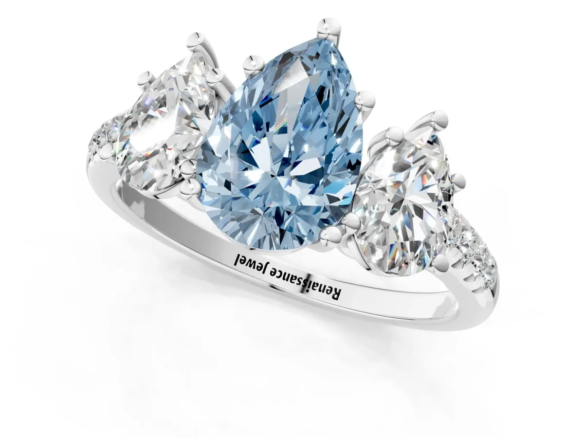 Fancy Blue Three-Stone Pear Cut Diamond Ring with Round Pavé Band and Prong Setting Silver