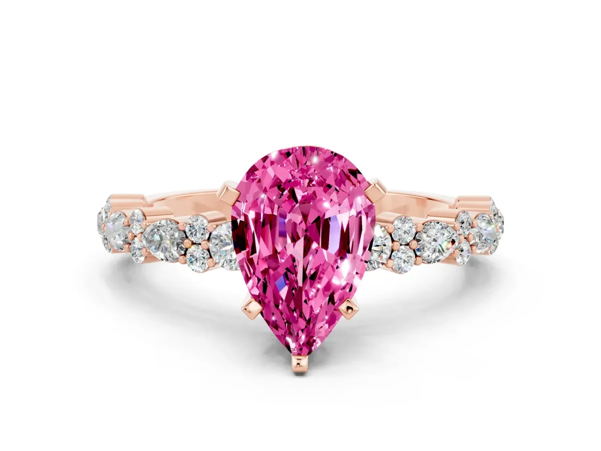 Pear Cut Pink Sapphire Side Stone Solitaire Ring with Round and Four-Prong Setting Rose gold