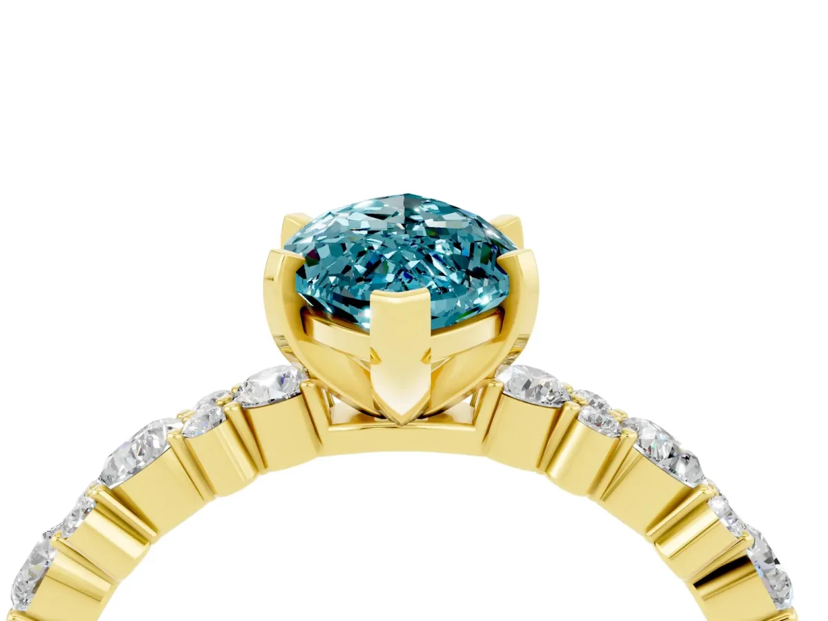 Marquise Cut Blue Topaz Side Stone Solitaire Ring with Round and Four-Prong Setting Yellow gold