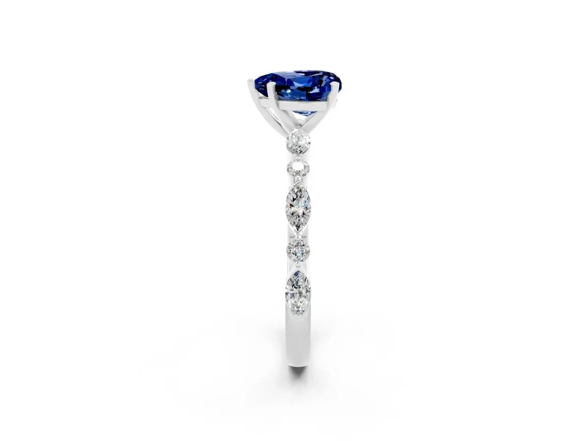 Heart Cut Blue Sapphire Ring with Marquise and Round Side Stones and Four-Prong Setting Silver