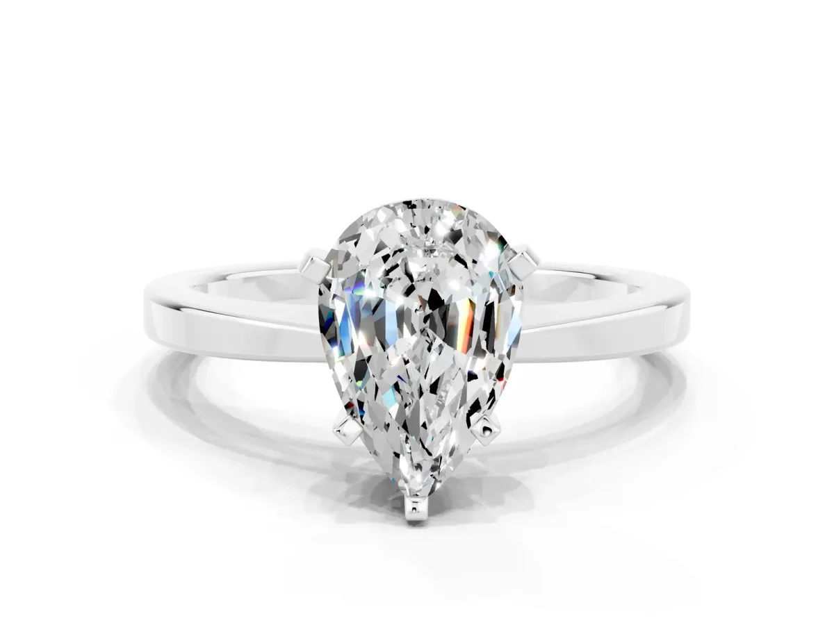 Pear Cut Moissanite Solitaire Engagement Ring with Classic Band and Four-Prong Setting Silver