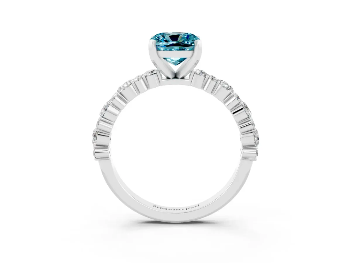 Cushion Cut Blue Topaz Side Stone Solitaire Ring with Round and Four-Prong Setting Platinum