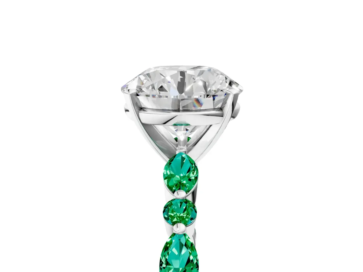 Round Cut Diamond Ring with Marquise and Round Emerald Side Stones and Four-Prong Setting Platinum