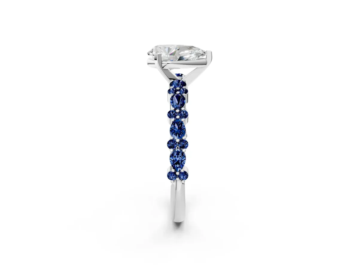 Pear Cut Diamond Side Stone Solitaire Ring with Round Blue Sapphire and Four-Prong Setting Platinum