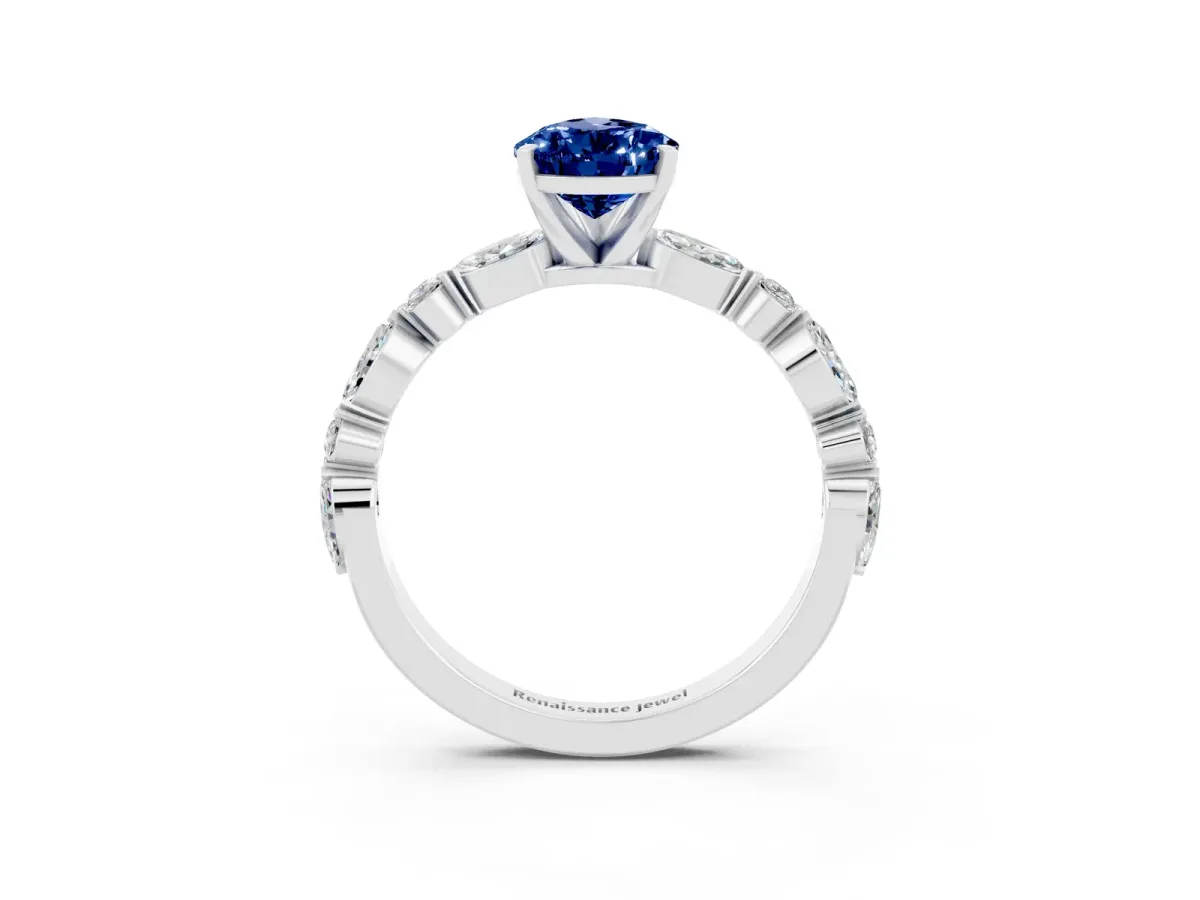 Pear Cut Blue Sapphire Ring with Marquise and Round Side Stones and Four-Prong Setting Silver