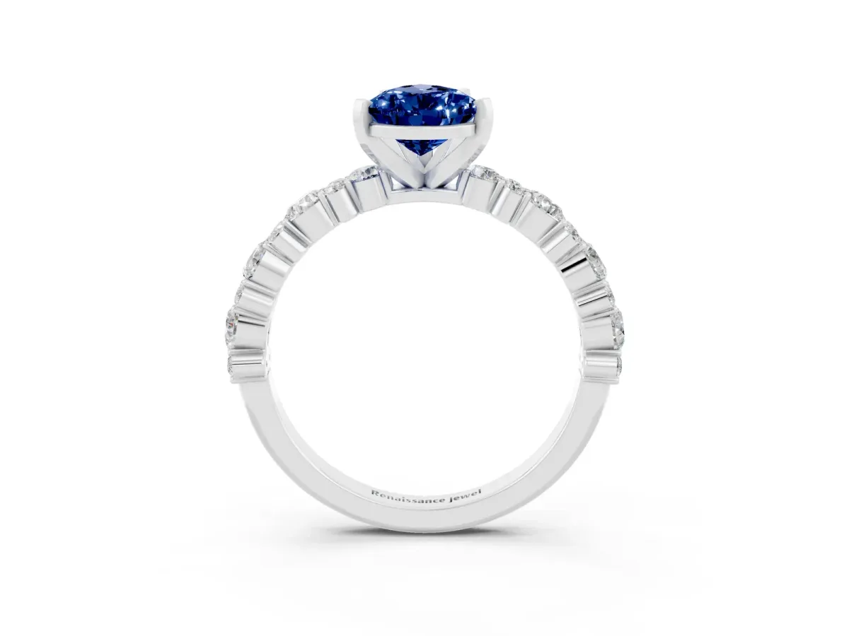 Pear Cut Blue Sapphire Side Stone Solitaire Ring with Round and Four-Prong Setting White gold