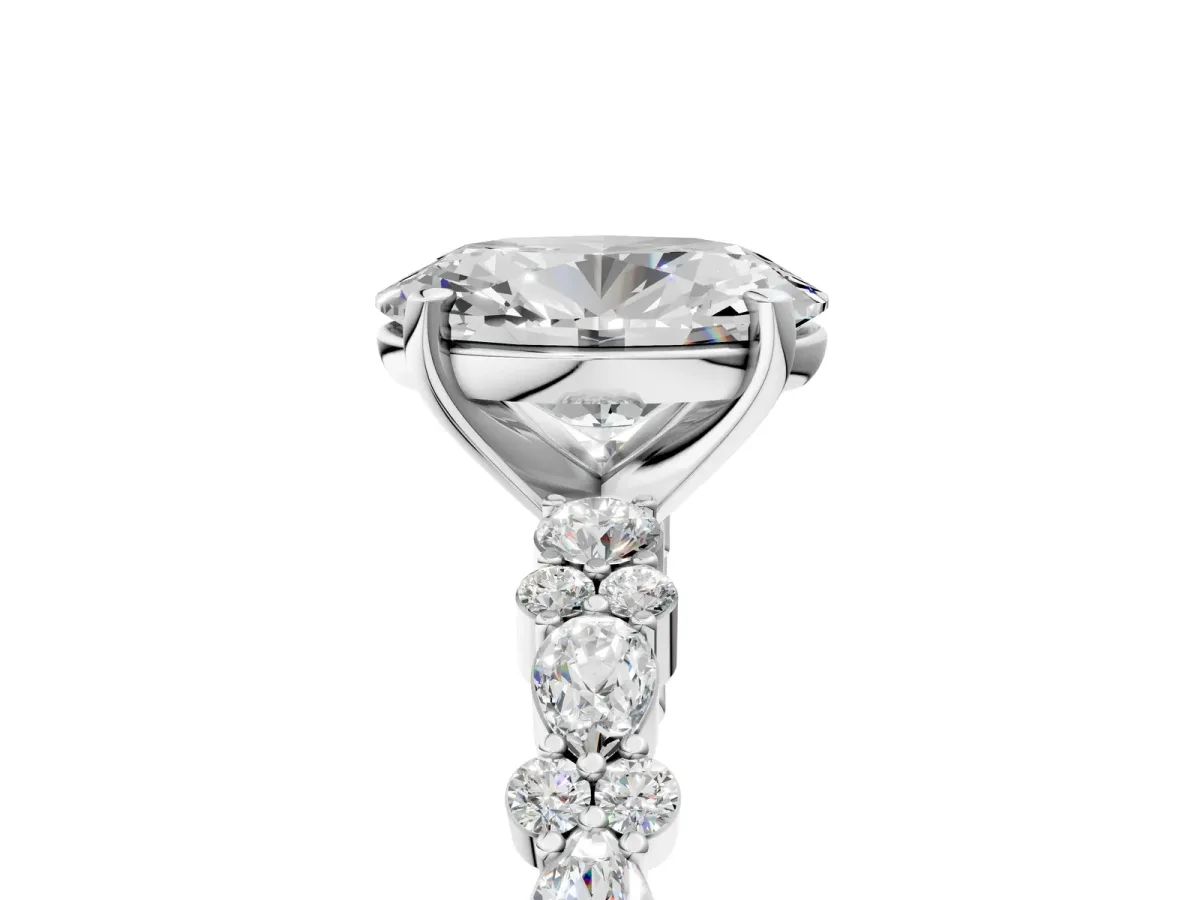 Oval Cut Diamond Side Stone Solitaire Ring with Round Moissanite and Four-Prong Setting White gold