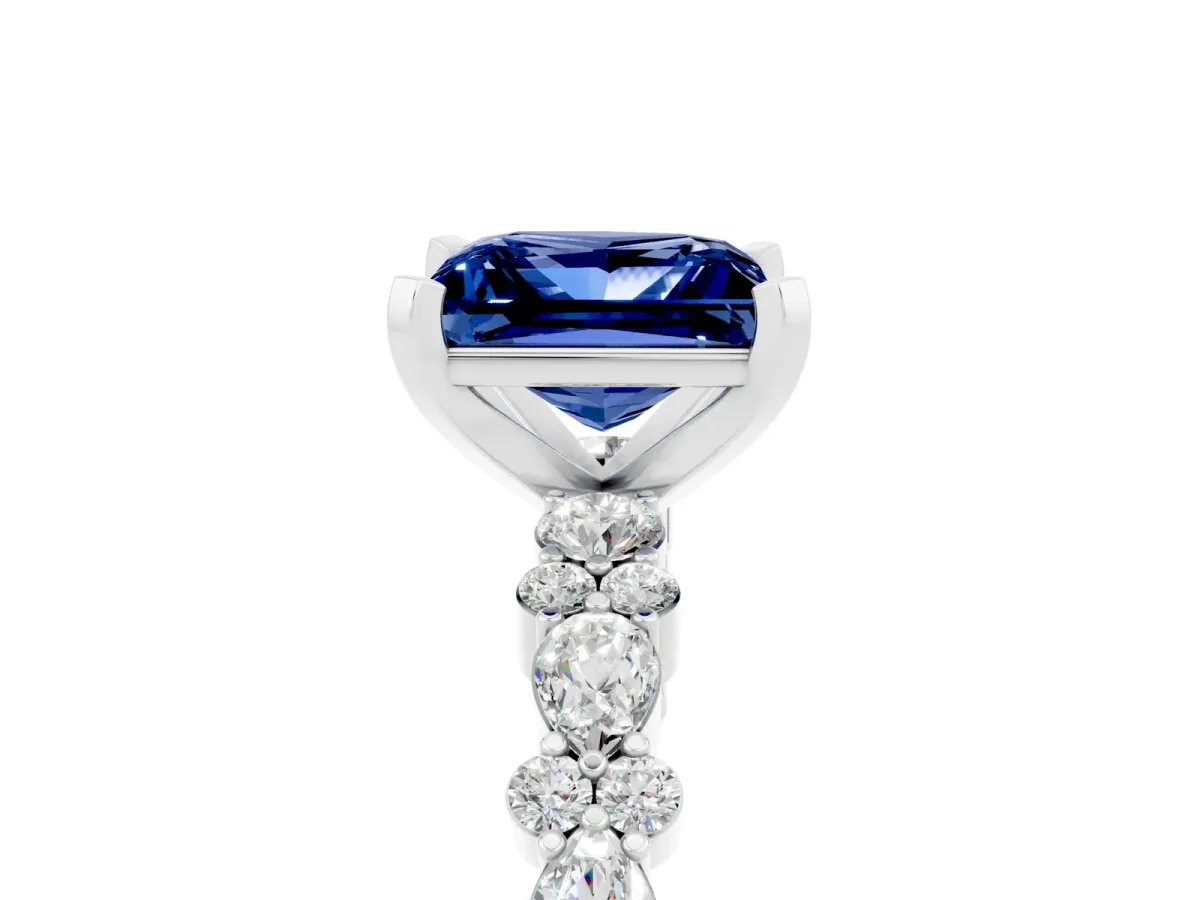 Princess Cut Blue Sapphire Side Stone Solitaire Ring with Round and Four-Prong Setting Platinum
