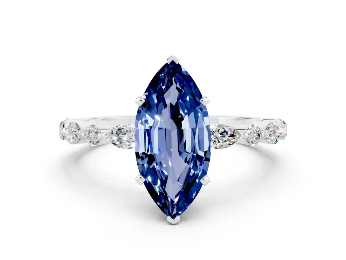 Marquise Cut Blue Sapphire Ring with Marquise and Round Side Stones and Four-Prong Setting Silver