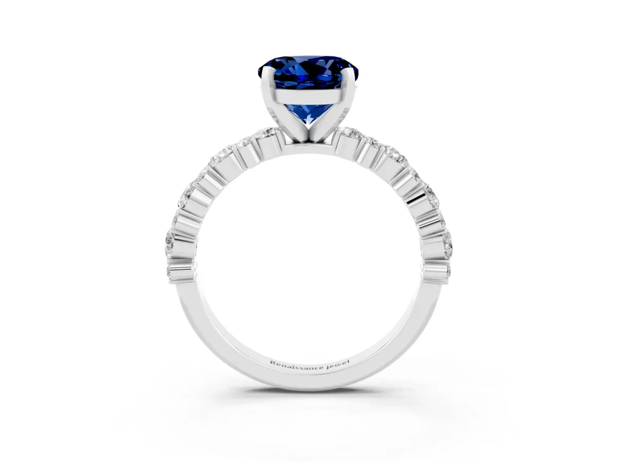 Round Cut Blue Sapphire Side Stone Solitaire Ring with Round and Four-Prong Setting White gold