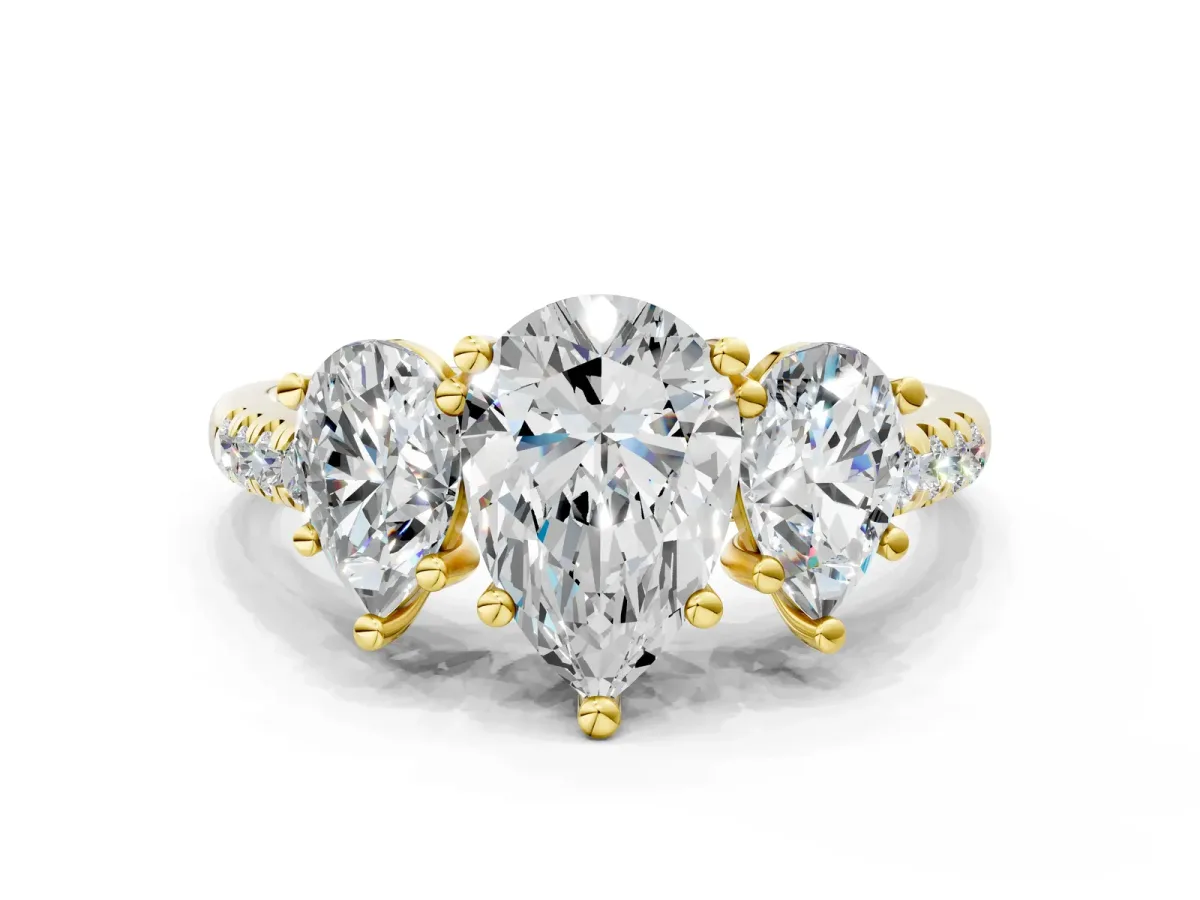 Three-Stone Pear Cut Diamond Ring with Round Pavé Band and Prong Setting Yellow gold