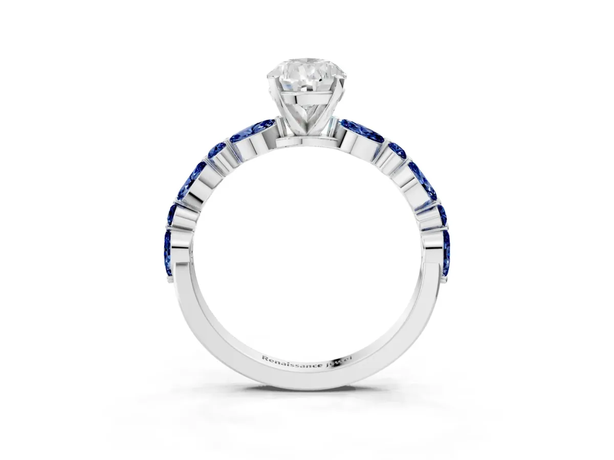 Pear Cut Diamond Ring with Marquise and Round Blue Sapphire Side Stones and Four-Prong Setting Platinum