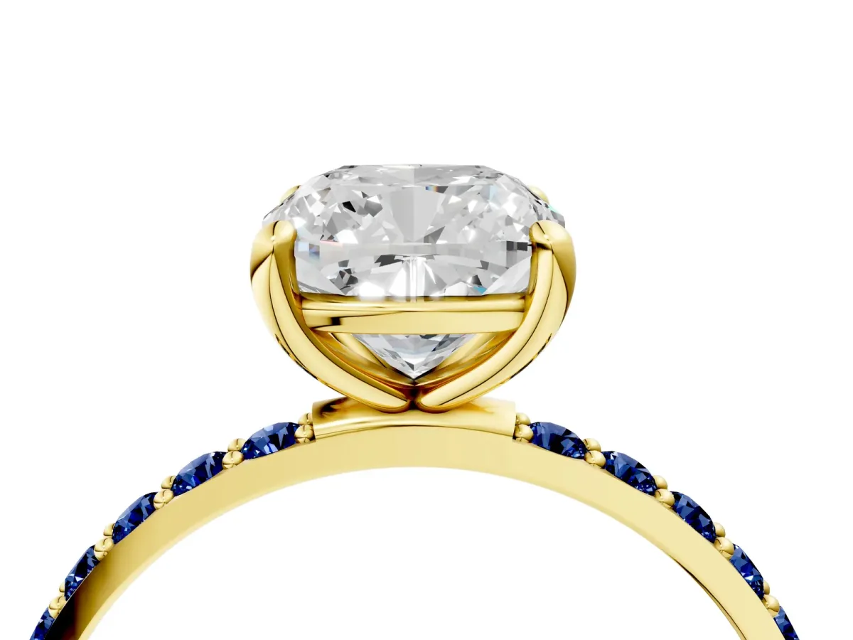 Cushion Cut Diamond Solitaire Ring with Round Blue Sapphire Pavé Band and Prong Setting Yellow gold