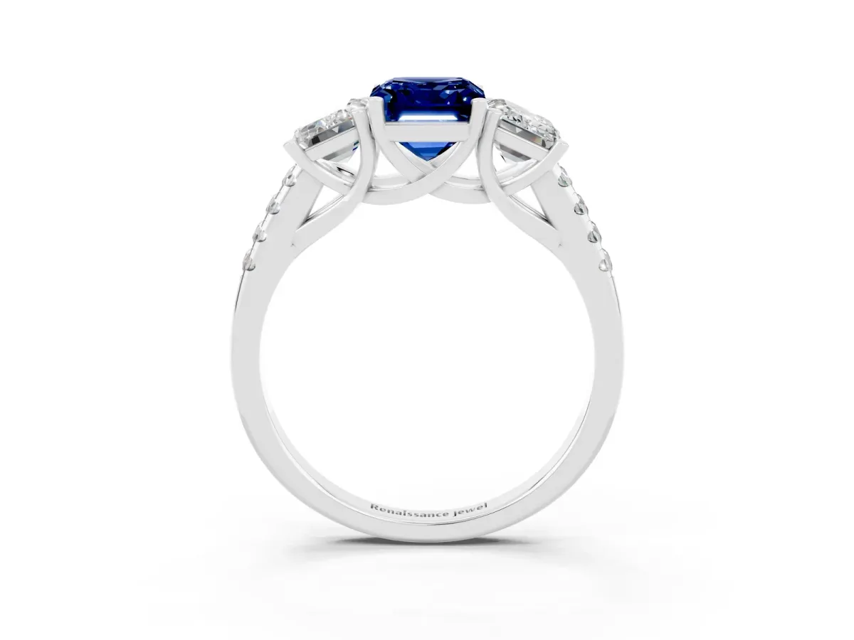 Three-Stone Emerald Cut Blue Sapphire Ring with Round Pavé Band and Prong Setting Platinum