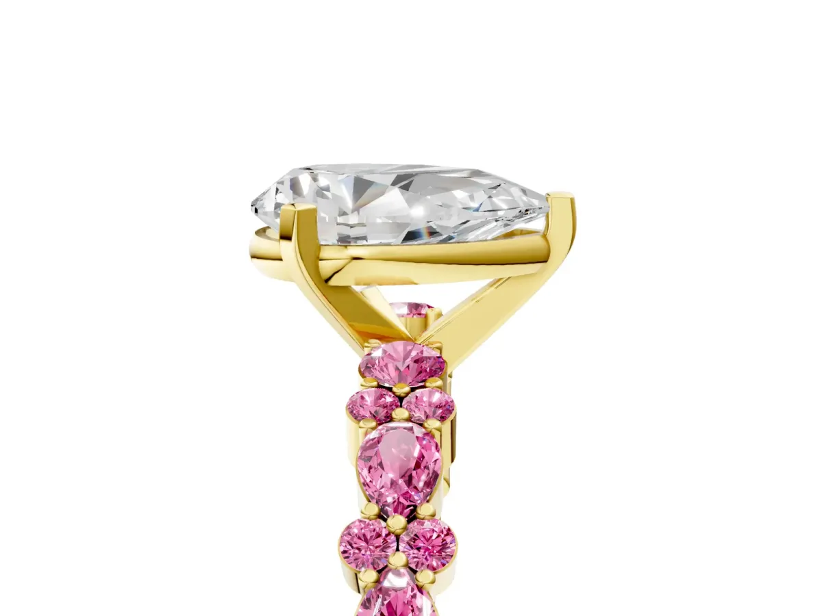 Pear Cut Diamond Side Stone Solitaire Ring with Round Pink Sapphire and Four-Prong Setting Yellow gold