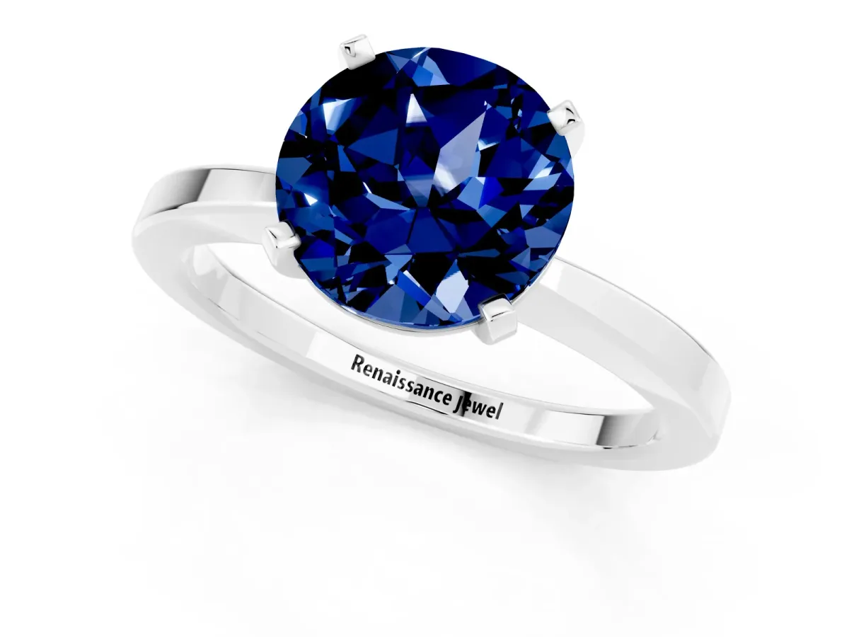 Round Cut Blue Sapphire Solitaire Engagement Ring with Classic Band and Four-Prong Setting Silver