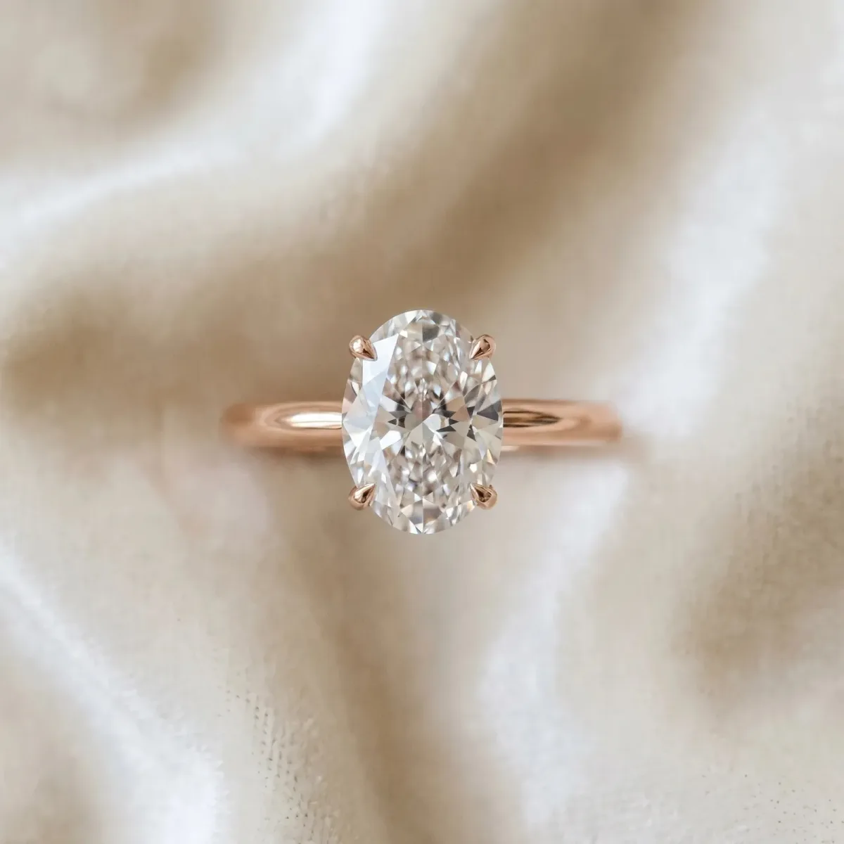 Oval Cut Diamond Solitaire Engagement Ring with Classic Band and Four-Prong Setting Rose gold
