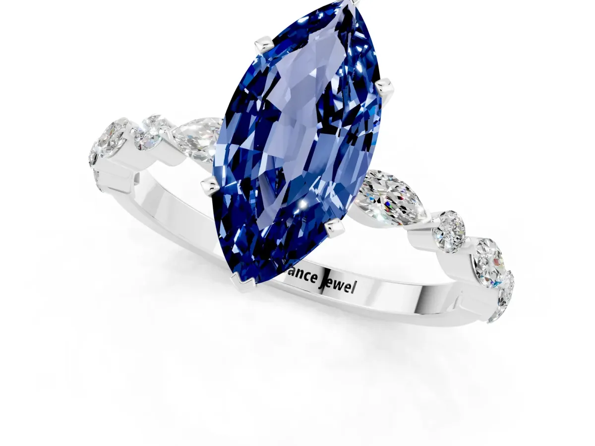 Marquise Cut Blue Sapphire Ring with Marquise and Round Side Stones and Four-Prong Setting Silver
