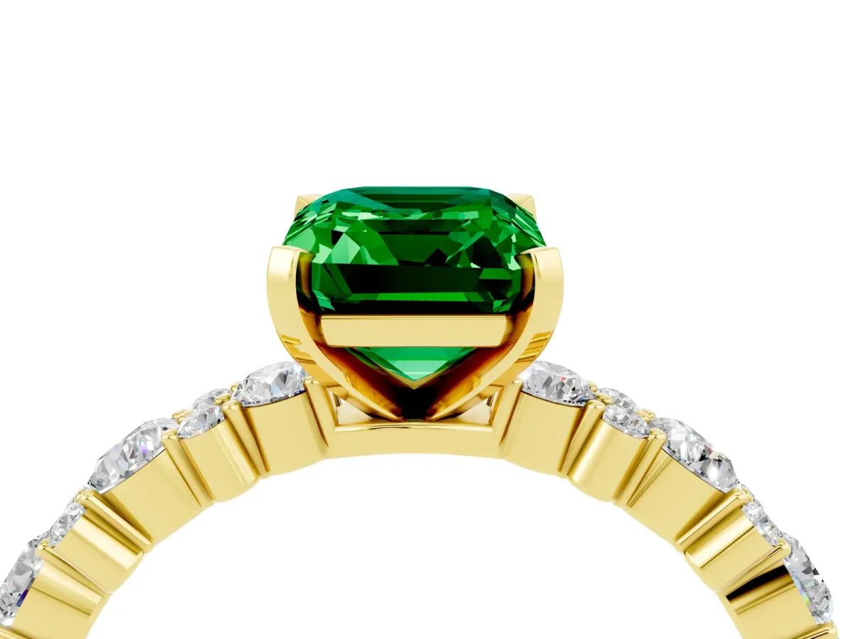 Emerald Cut Emerald Side Stone Solitaire Ring with Round and Four-Prong Setting Yellow gold